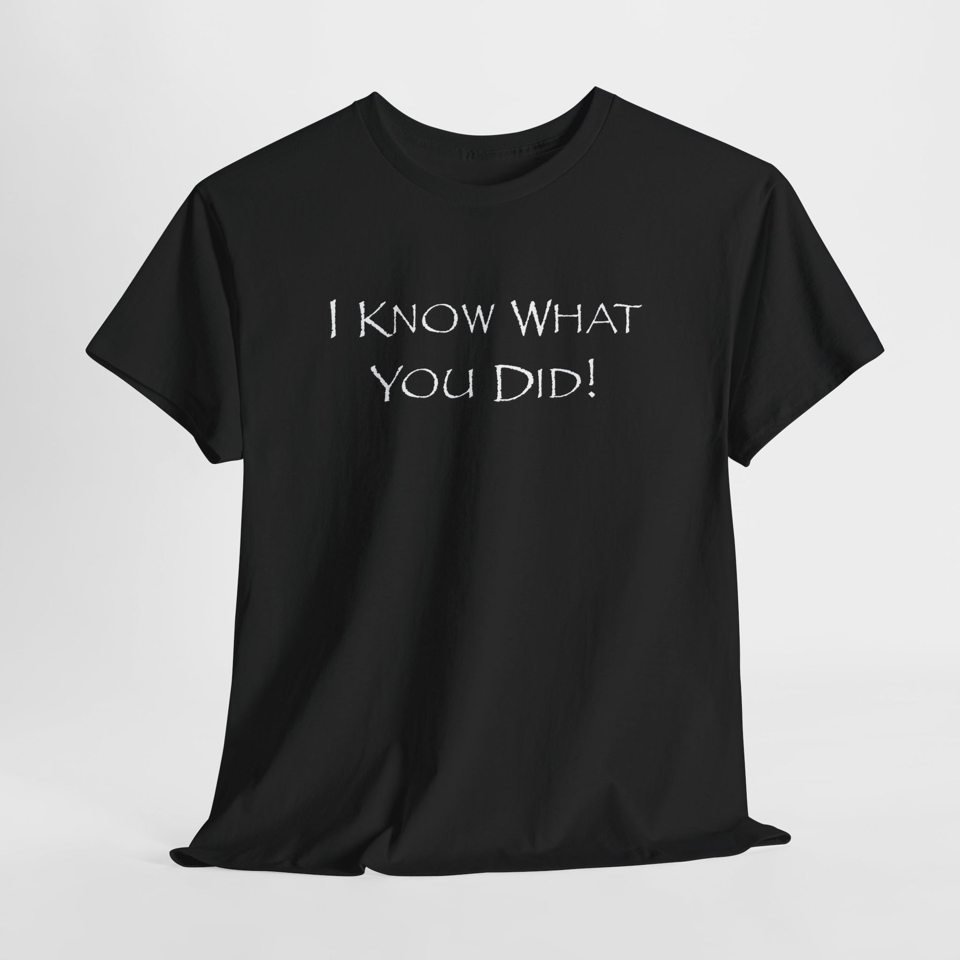 Black t-shirt with text 'I KNOW WHAT YOU DID!' on a light gray background