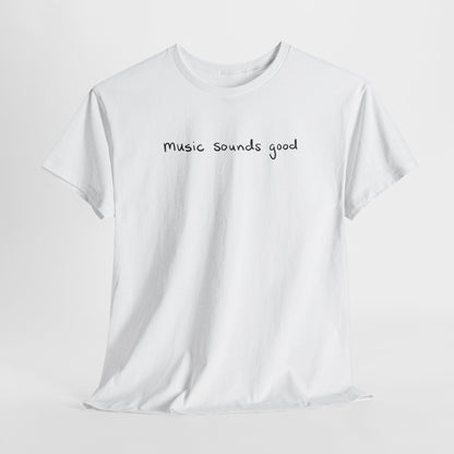 White t-shirt with 'music sounds good' text on a white background