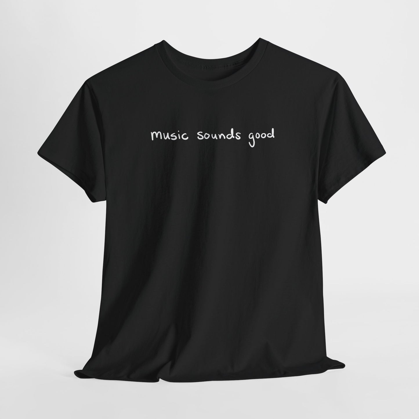 Black t-shirt with 'music sounds good' text on a white background