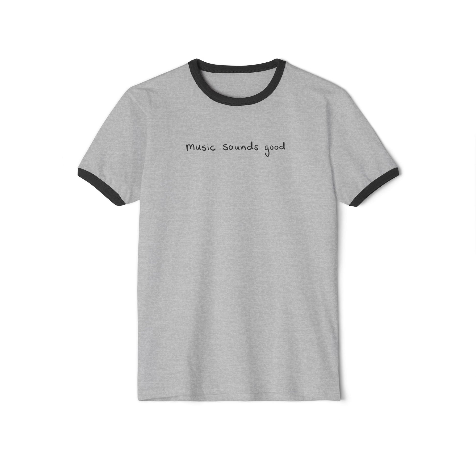 Gray ringer t-shirt with black trim and the text 'music souunds good', on a white background