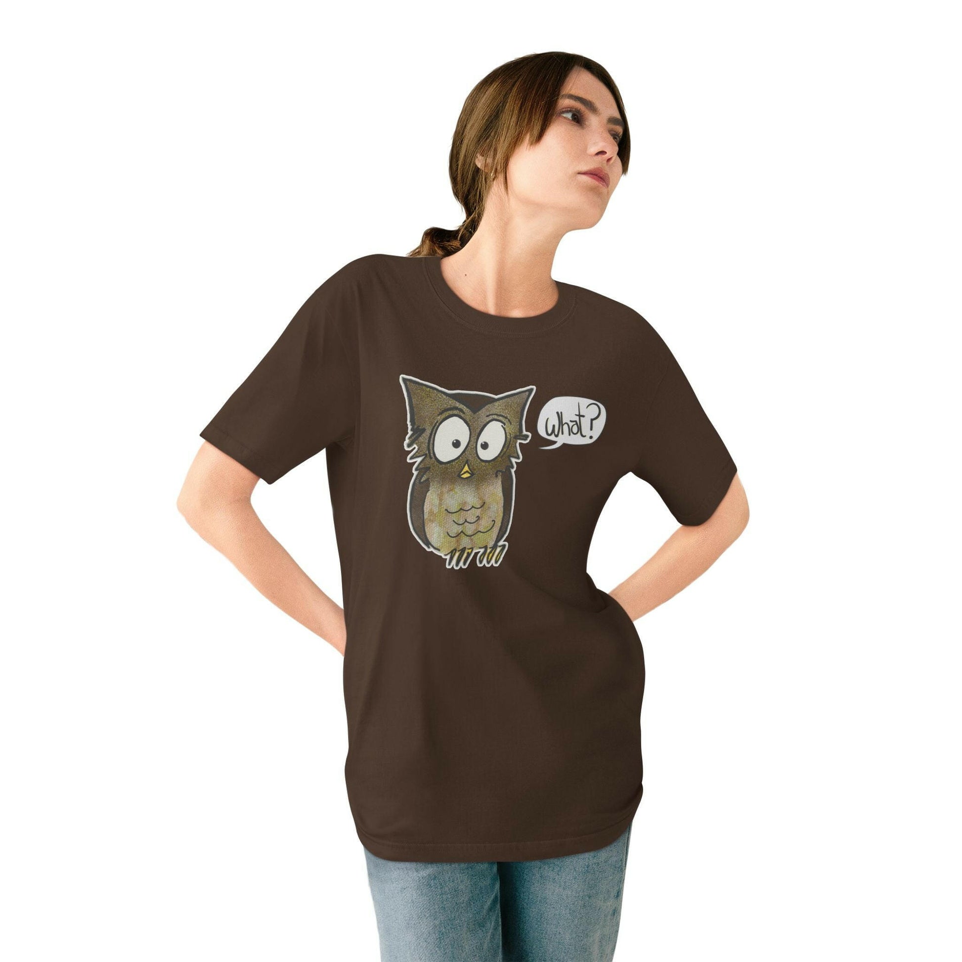 Woman wearing a brown t-shirt with an owl graphic and 'What?' speech bubble on a white background