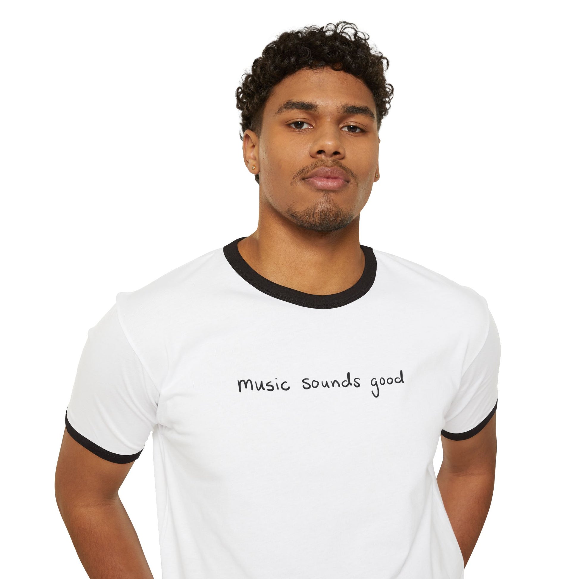 Man wearing a white ringer t-shirt with 'music sounds good' text on a white background