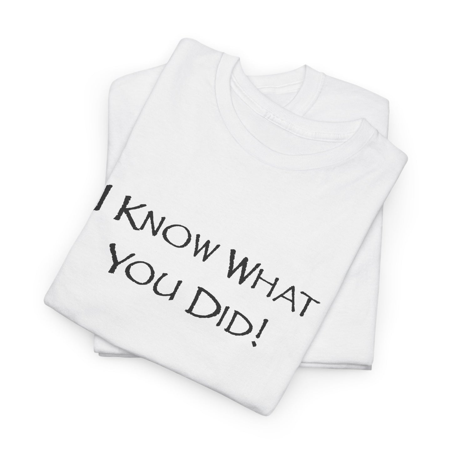Folded white t-shirt with 'I KNOW WHAT YOU DID!' text on a white background