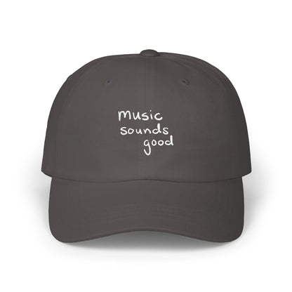 Gray cap with 'music sounds good' text on a white background