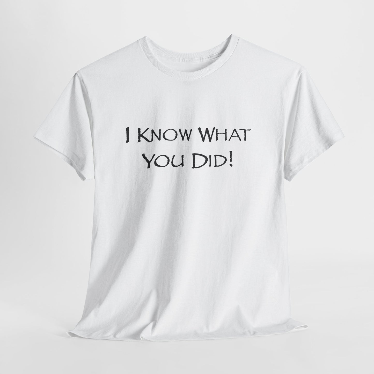 White t-shirt with black text 'I KNOW WHAT YOU DID!' on a light gray background
