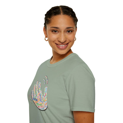 Person wearing a green T-shirt with a colorful hand graphic filled with greetings from many languages - on a white background