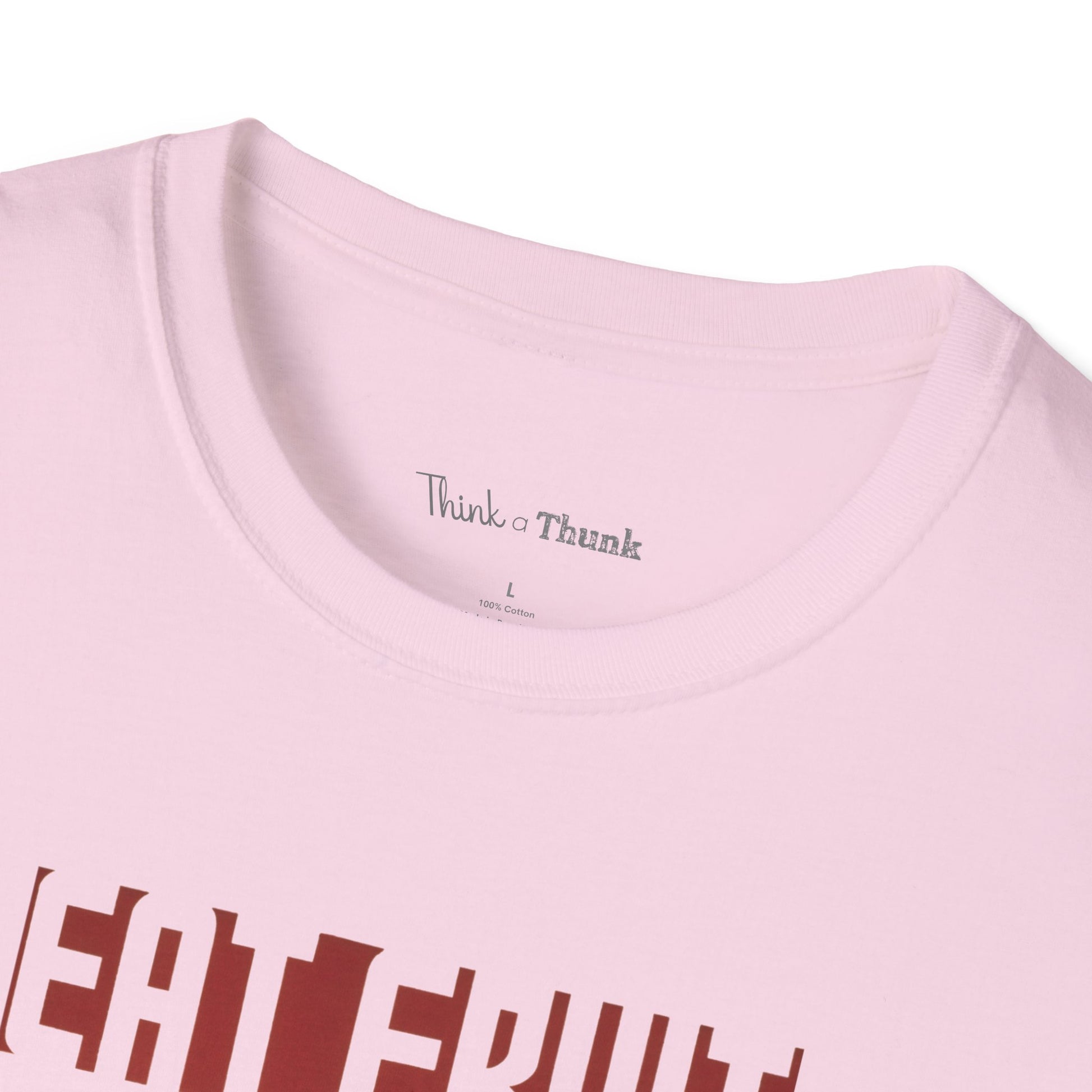 Close-up of a pink t-shirt with 'Think a Thunk' branding on a white background