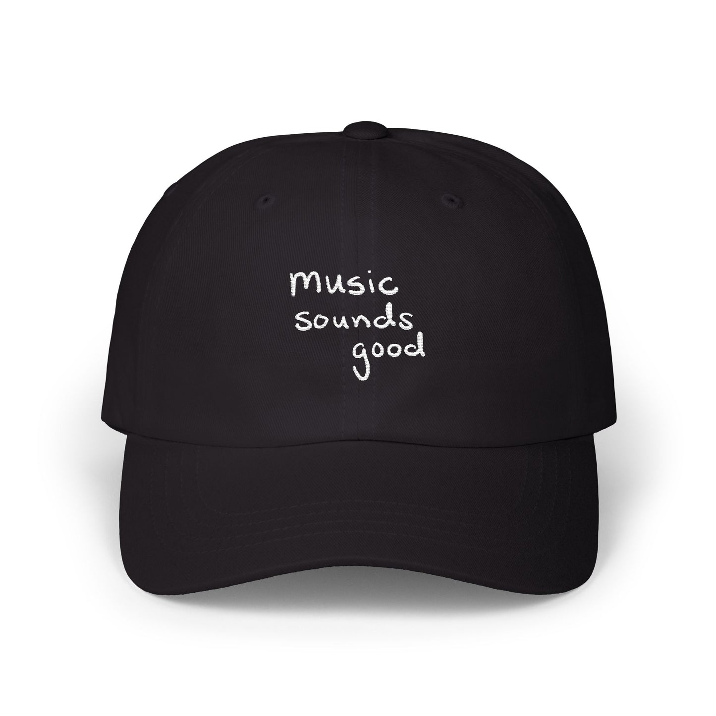 Black cap with 'music sounds good' text on a white background
