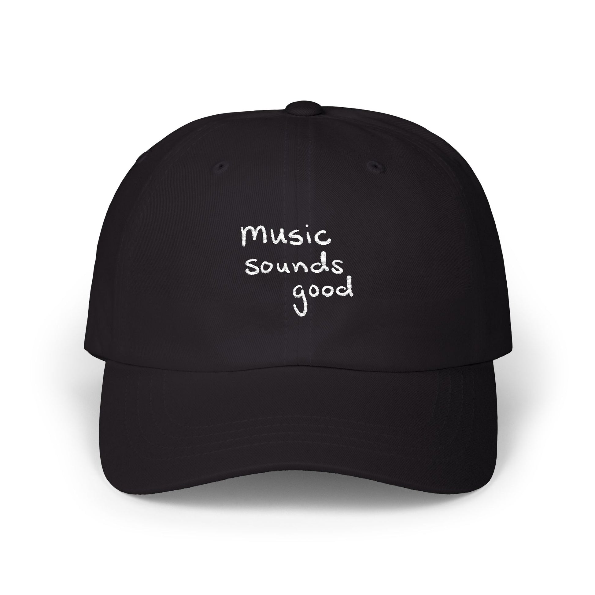 Black cap with 'music sounds good' text on a white background