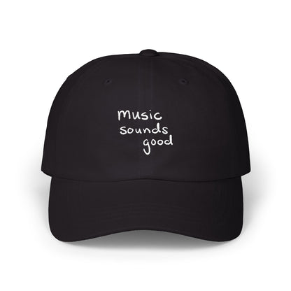 Black cap with 'music sounds good' text on a white background