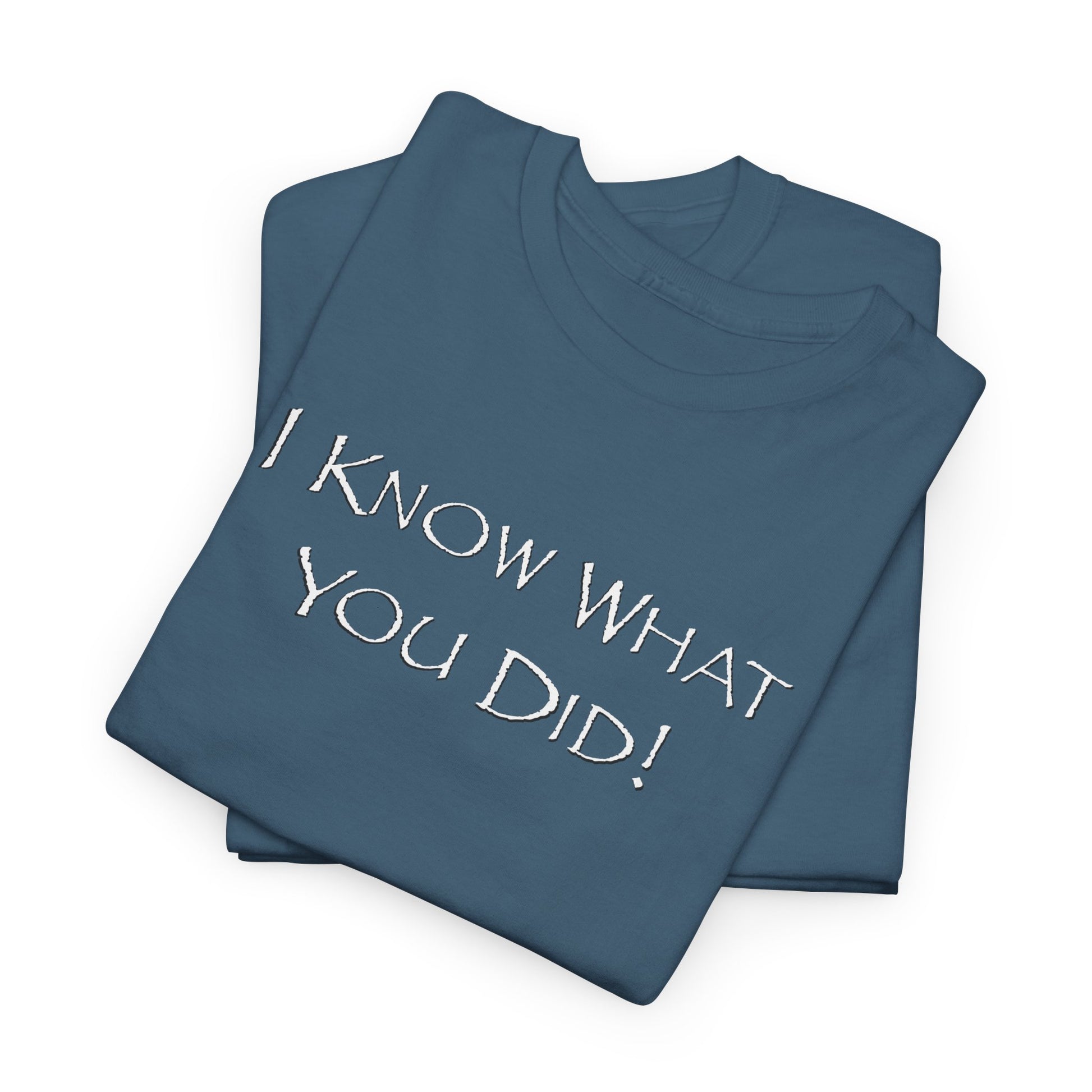 Folded blue t-shirt with 'I KNOW WHAT YOU DID!' text on a white background